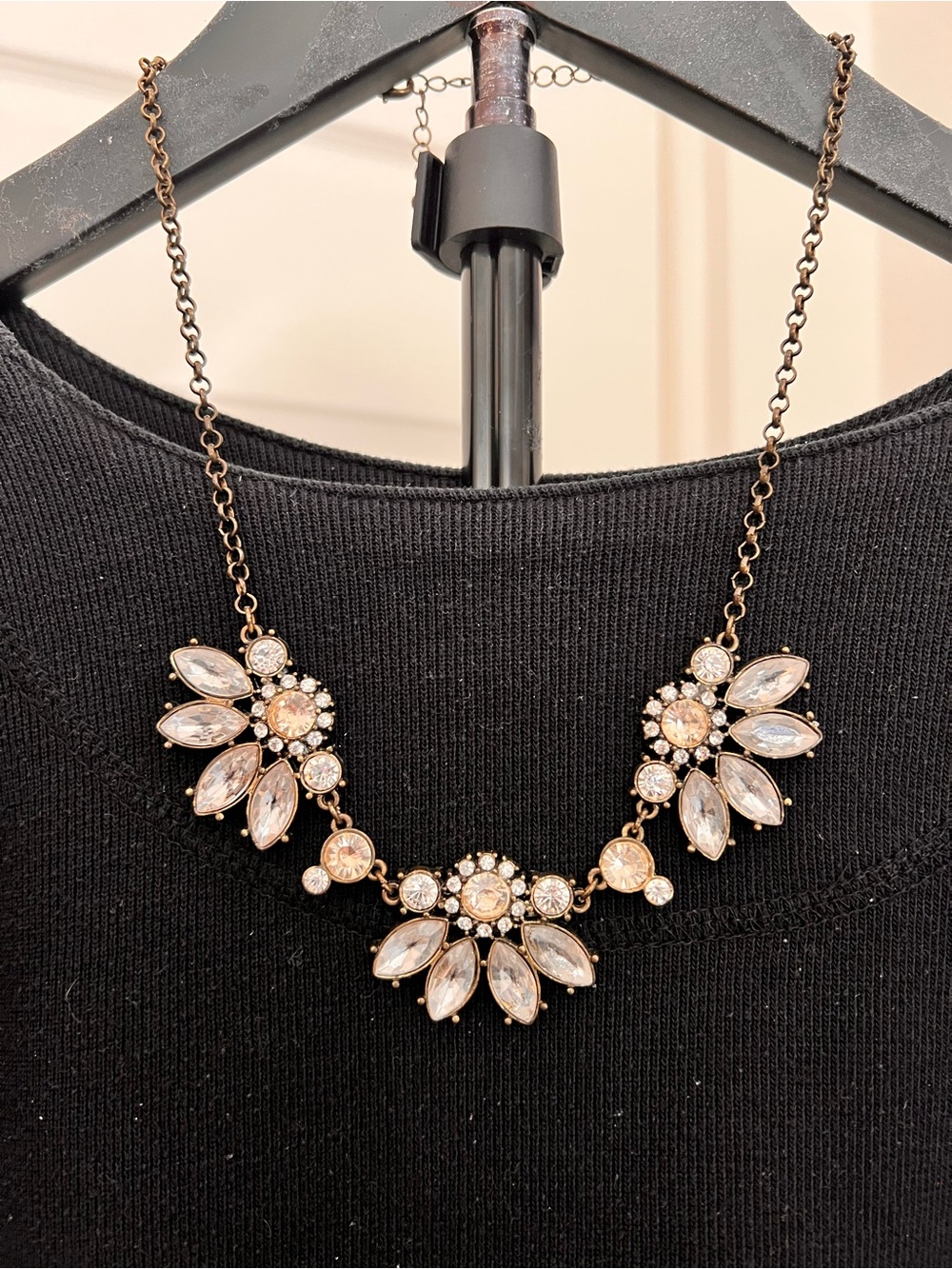 Bib style three flower necklace with large crystal petals set on a bronze chain